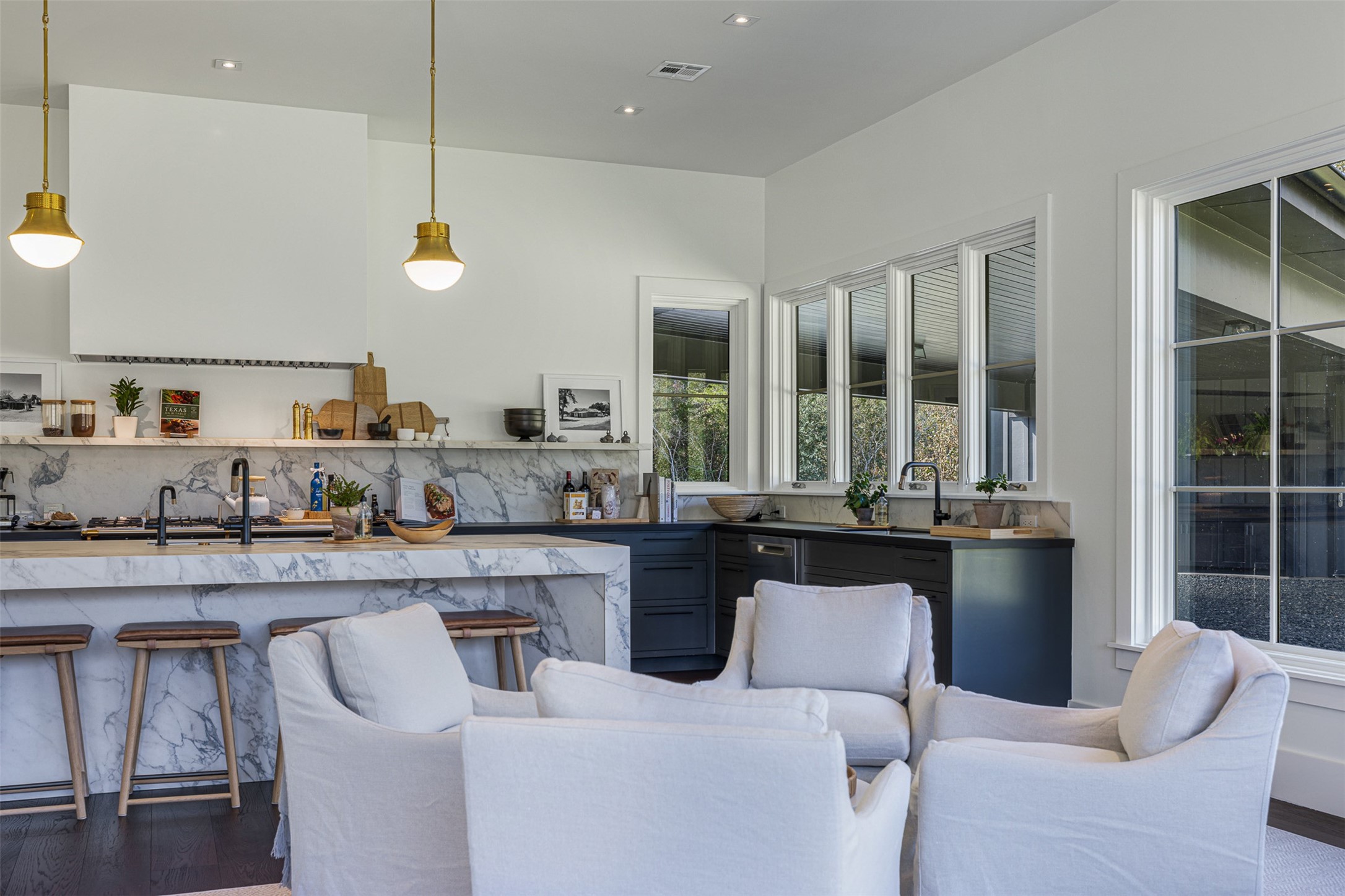 830 South Weyand Road Round Top, TX 78954 - Photo 23 of 35 a large kitchen with a table and chairs in it