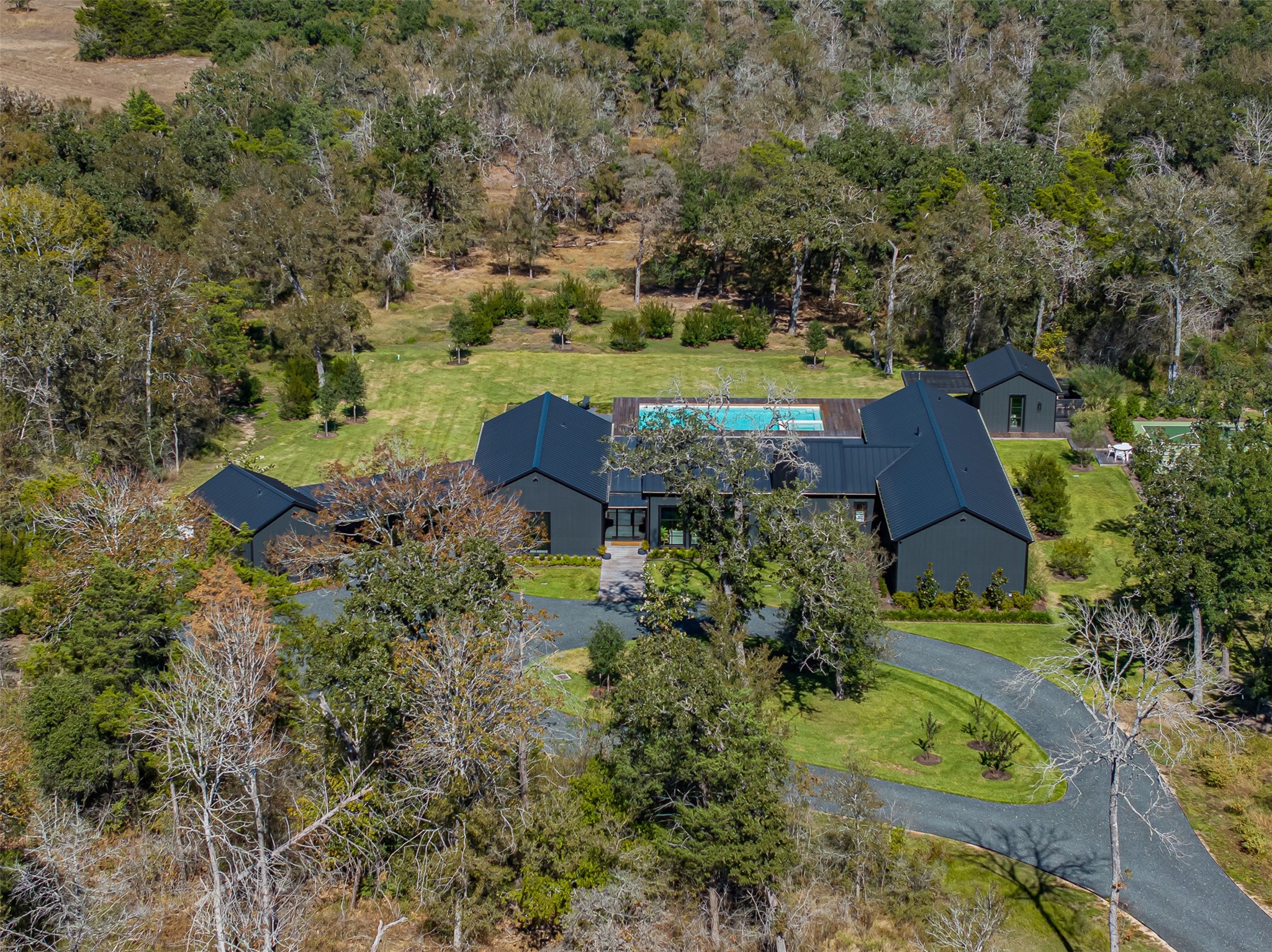 830 South Weyand Road Round Top, TX 78954 - Photo 31 of 35 an aerial view of a house with yard swimming pool and outdoor seating