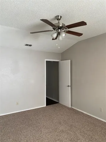 a bathroom with a granite countertop sink and tub