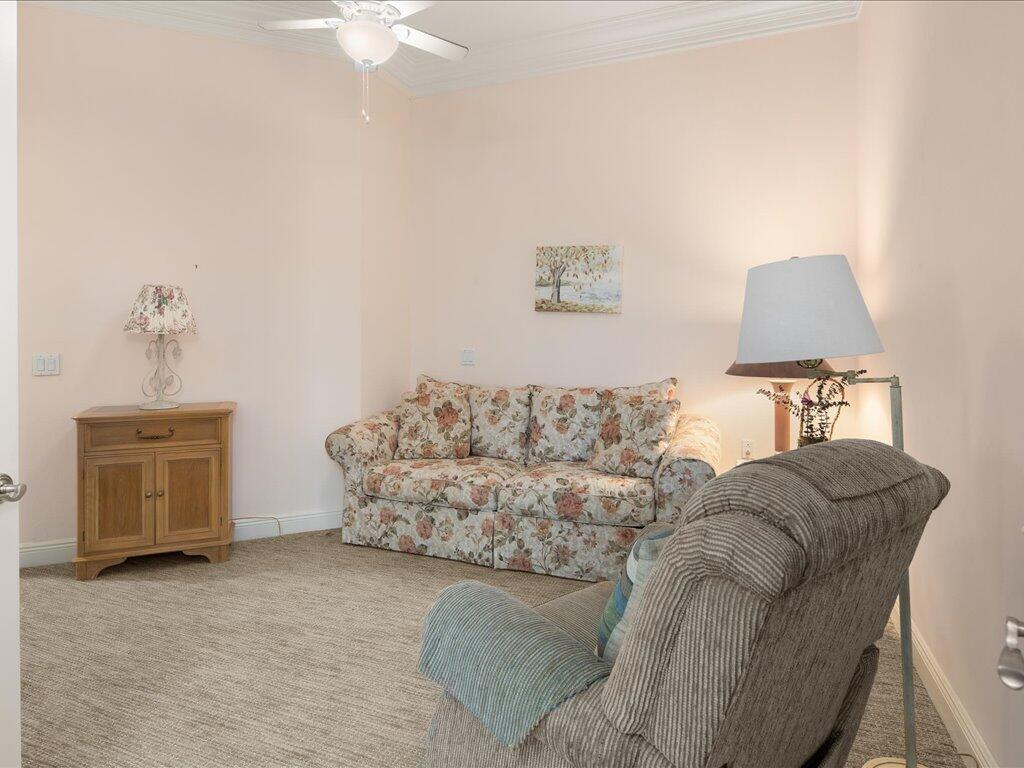 1498 Borghese Lane, Unit 101 Naples, FL 34114 - Photo 21 of 31 a living room with furniture and a couch
