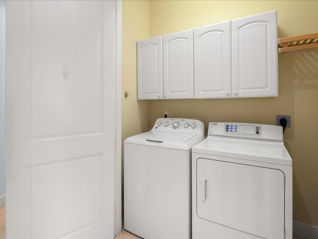 1498 Borghese Lane, Unit 101 Naples, FL 34114 - Photo 24 of 31 a utility room with dryer and washer