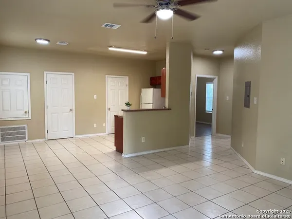 a view of an empty room and window