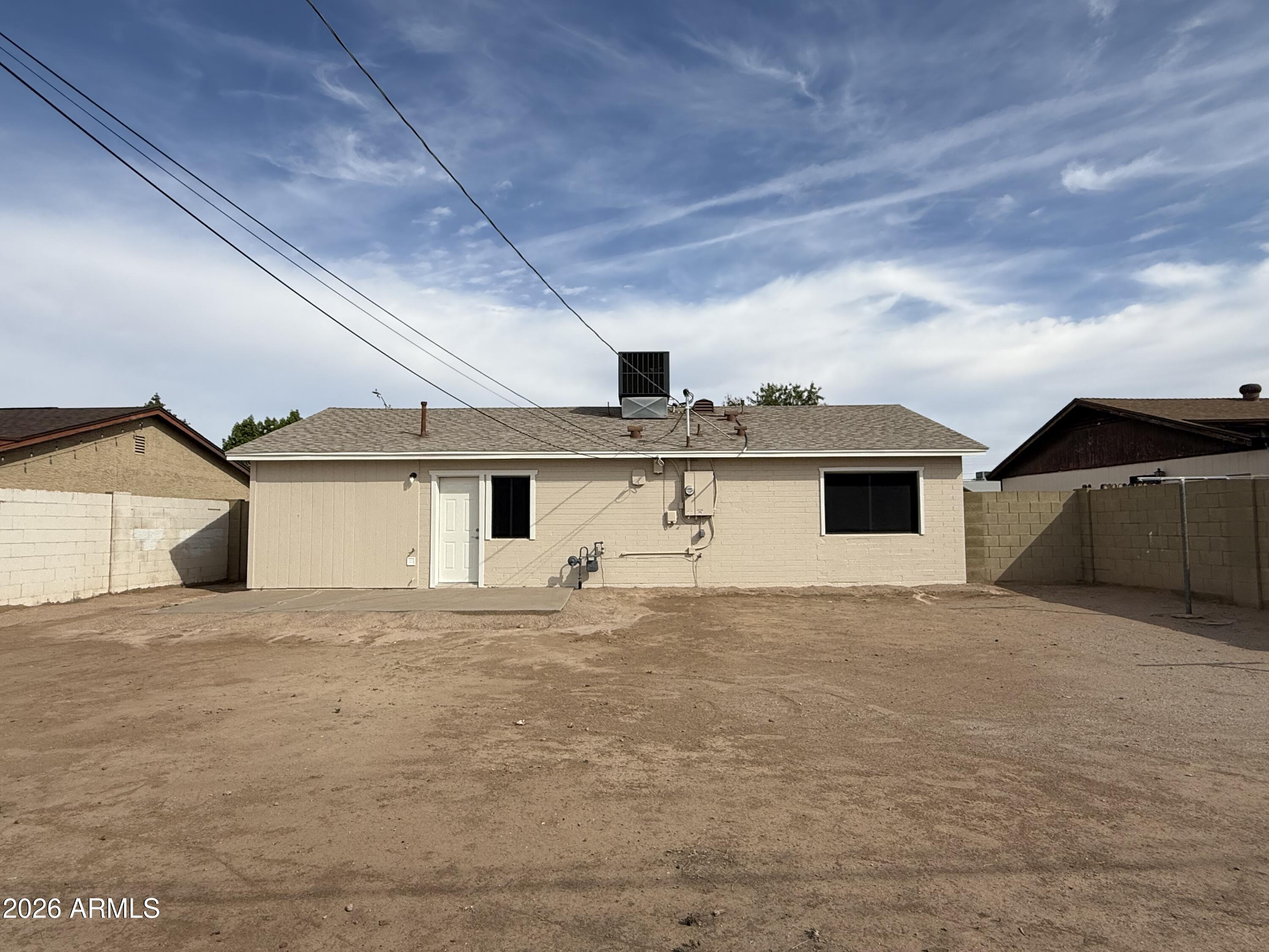 5807 West Flower Street Phoenix, AZ 85031 - Photo 2 of 11 a big house with a outdoor space