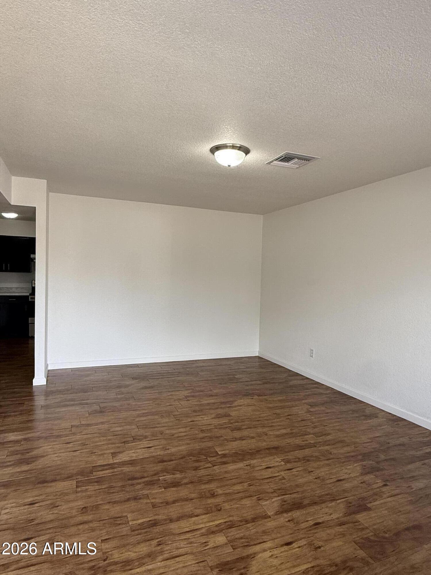5807 West Flower Street Phoenix, AZ 85031 - Photo 3 of 11 a view of room with an empty space