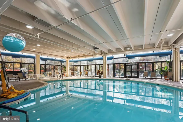 a view of a swimming pool with a patio