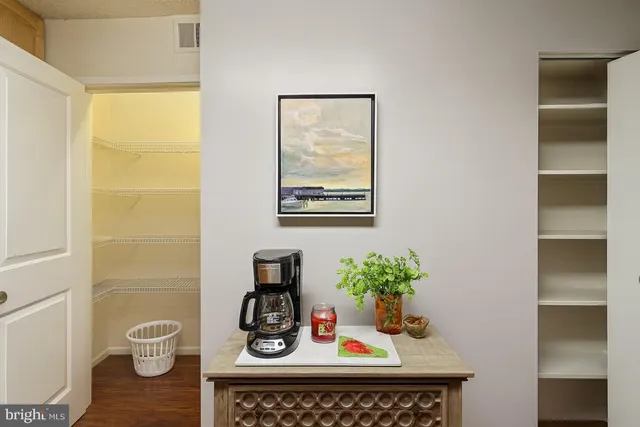 a table with a vase and flowers on it