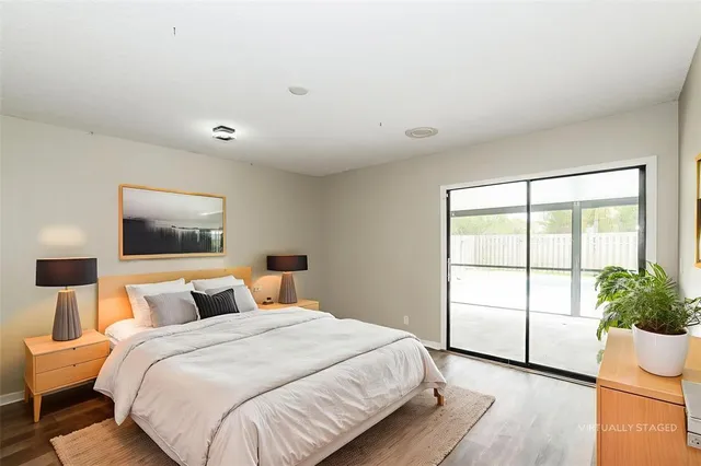 a bedroom with a large bed and a window