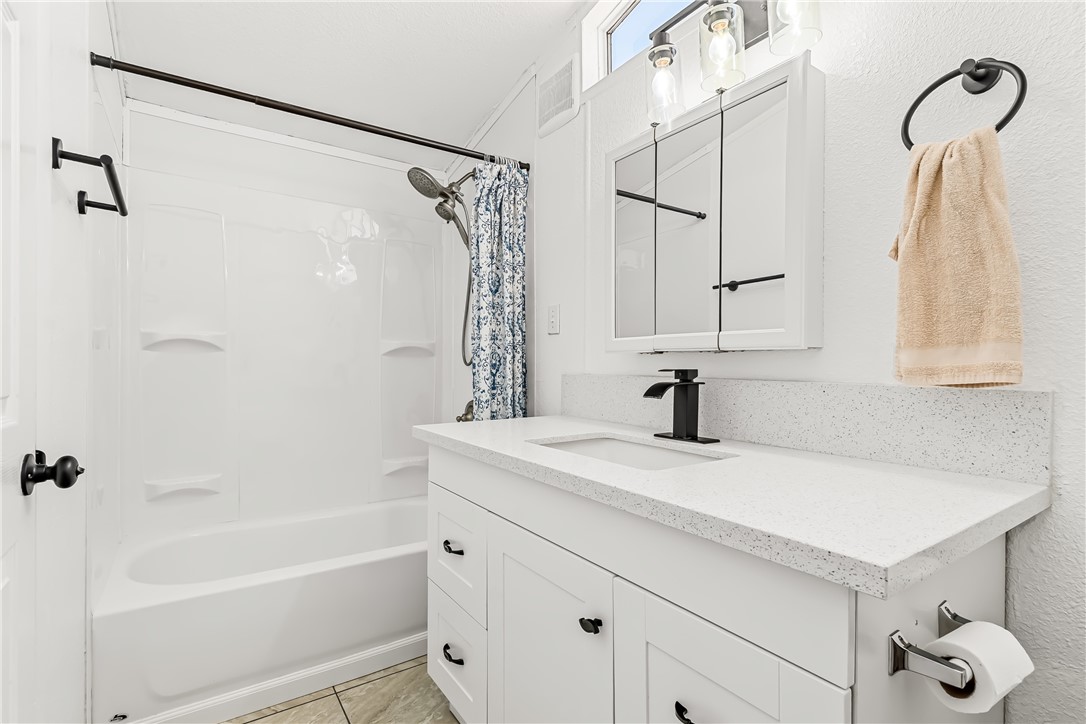 1655 Dunlap Road Fort Mohave, AZ 86426 - Photo 21 of 37 a bathroom with a sink bath tub and a shower