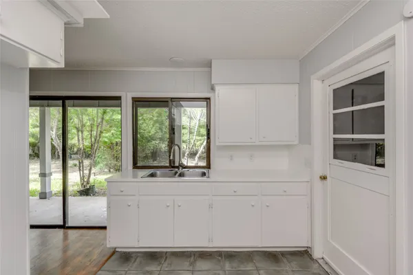 a view of bathroom with bathtub and windows