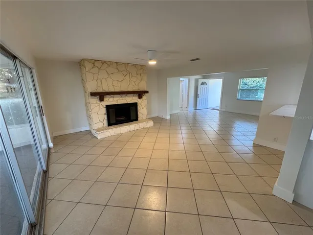 a view of an empty room and glass door