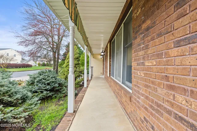 a view of a pathway both side of house