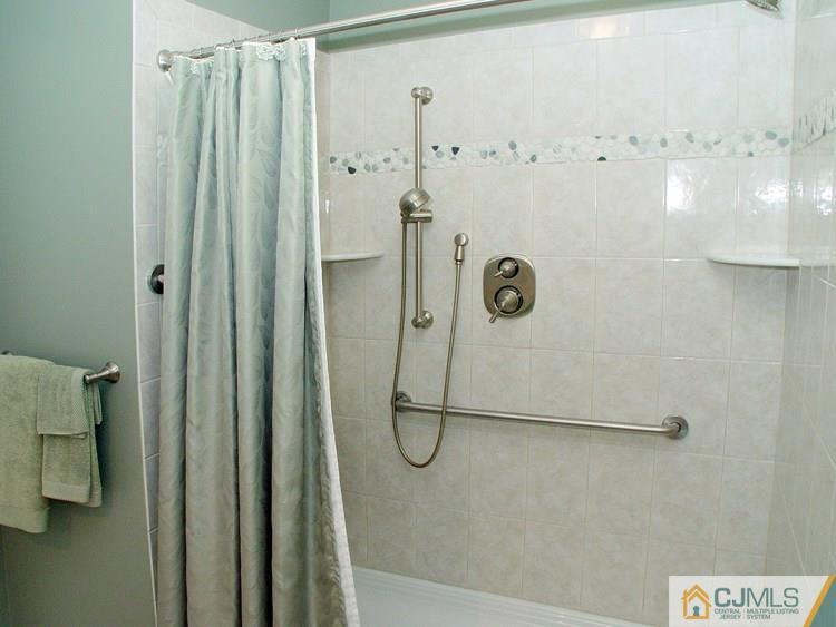 124 Drake Road Somerset, NJ 08873 - Photo 14 of 24 a bathroom with a glass shower door
