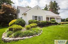 124 Drake Road Somerset, NJ 08873 - Photo 3 of 24 a view of a house with garden and plants