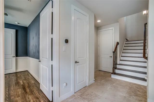 a view of a hallway with hallway with stairs