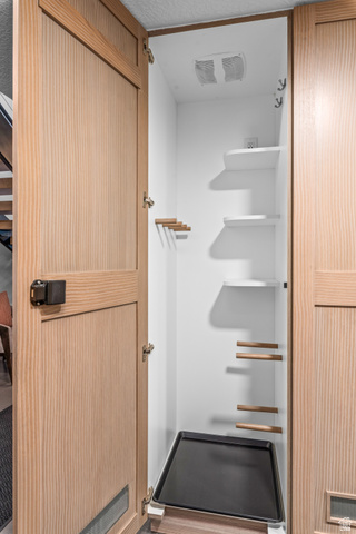 1258 Rothwell Road Park City, UT 84060 - Photo 47 of 48 Integrated utility closet featuring light wood-finish doors, white interior shelving, and a removable bottom tray