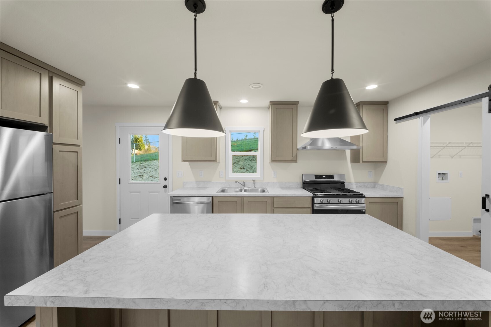 200 Lot C Fineview Chehalis, WA 98532 - Photo 11 of 36 a kitchen with stainless steel appliances granite countertop a sink a stove a refrigerator and island