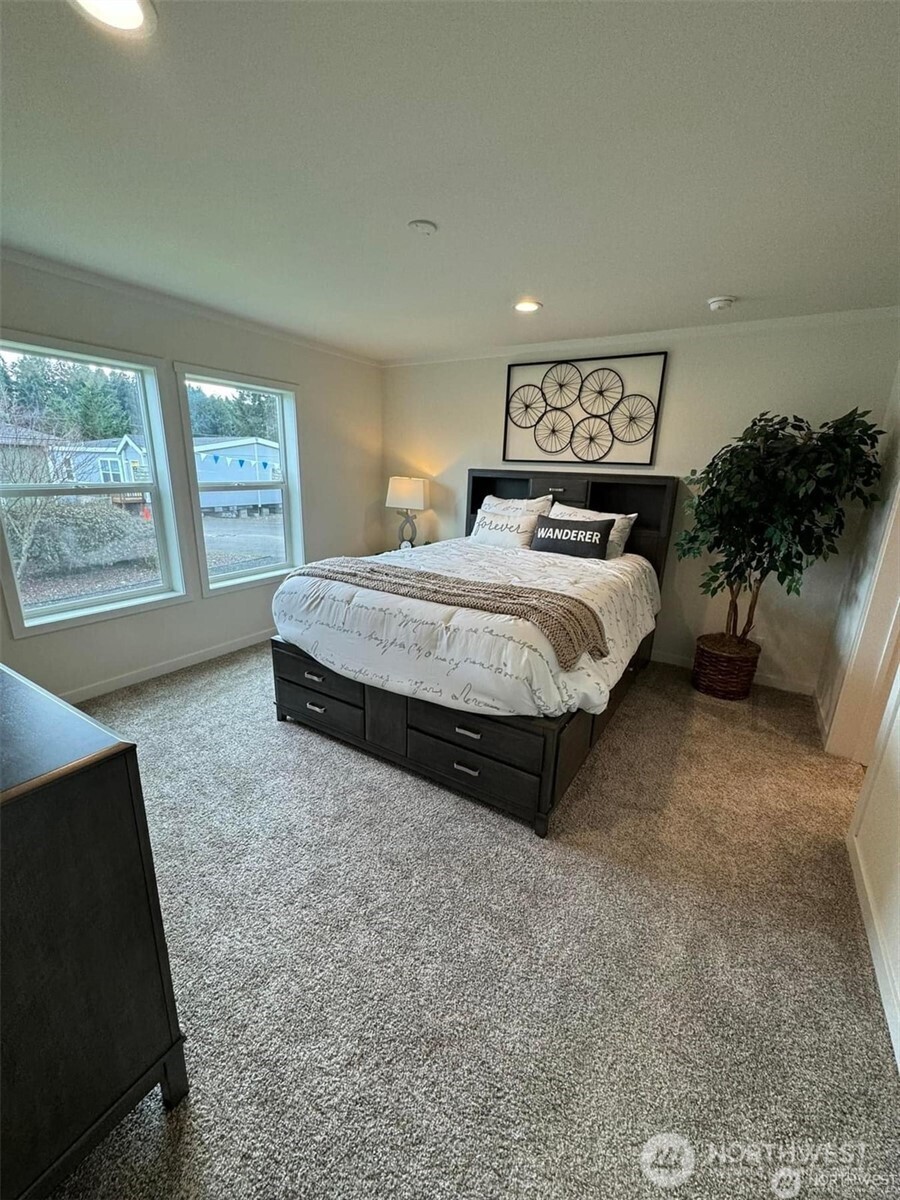 200 Lot C Fineview Chehalis, WA 98532 - Photo 10 of 31 a spacious bedroom with a bed and a large window