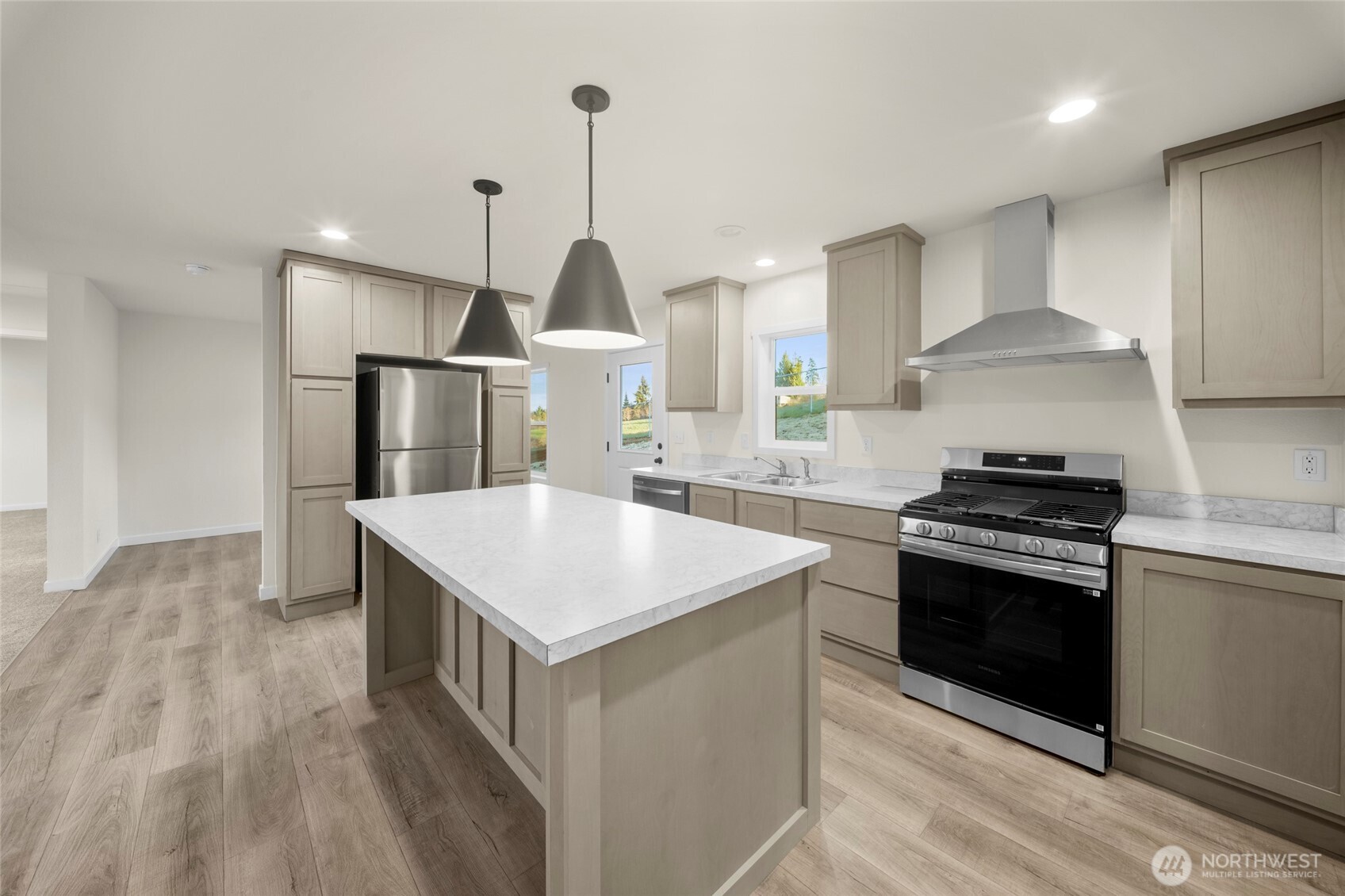 200 Lot C Fineview Chehalis, WA 98532 - Photo 10 of 36 a kitchen with stainless steel appliances kitchen island a sink stove and refrigerator