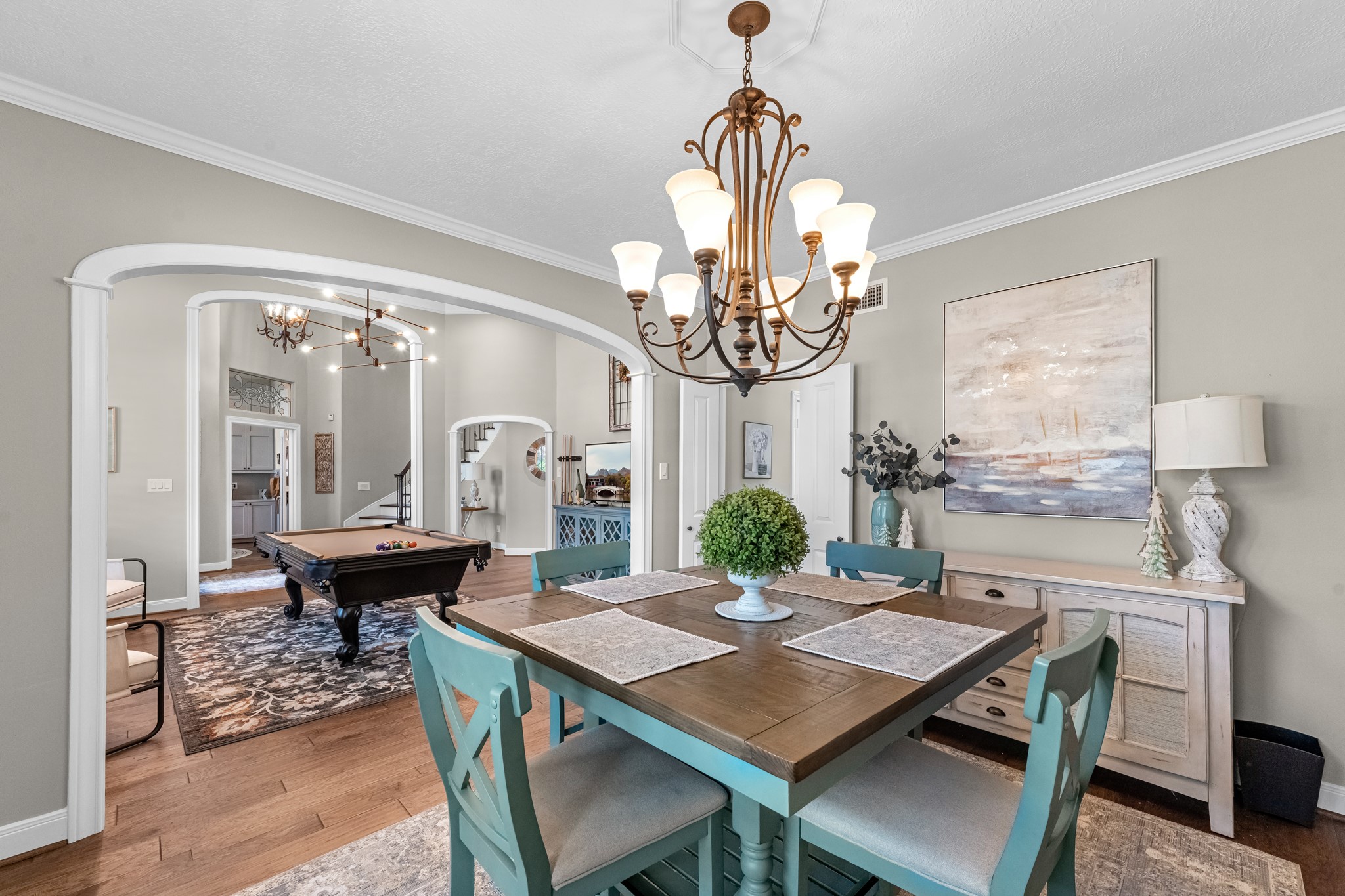 16207 Lafone Drive Spring, TX 77379 - Photo 13 of 49 a view of a dining room with furniture a chandelier and wooden floor