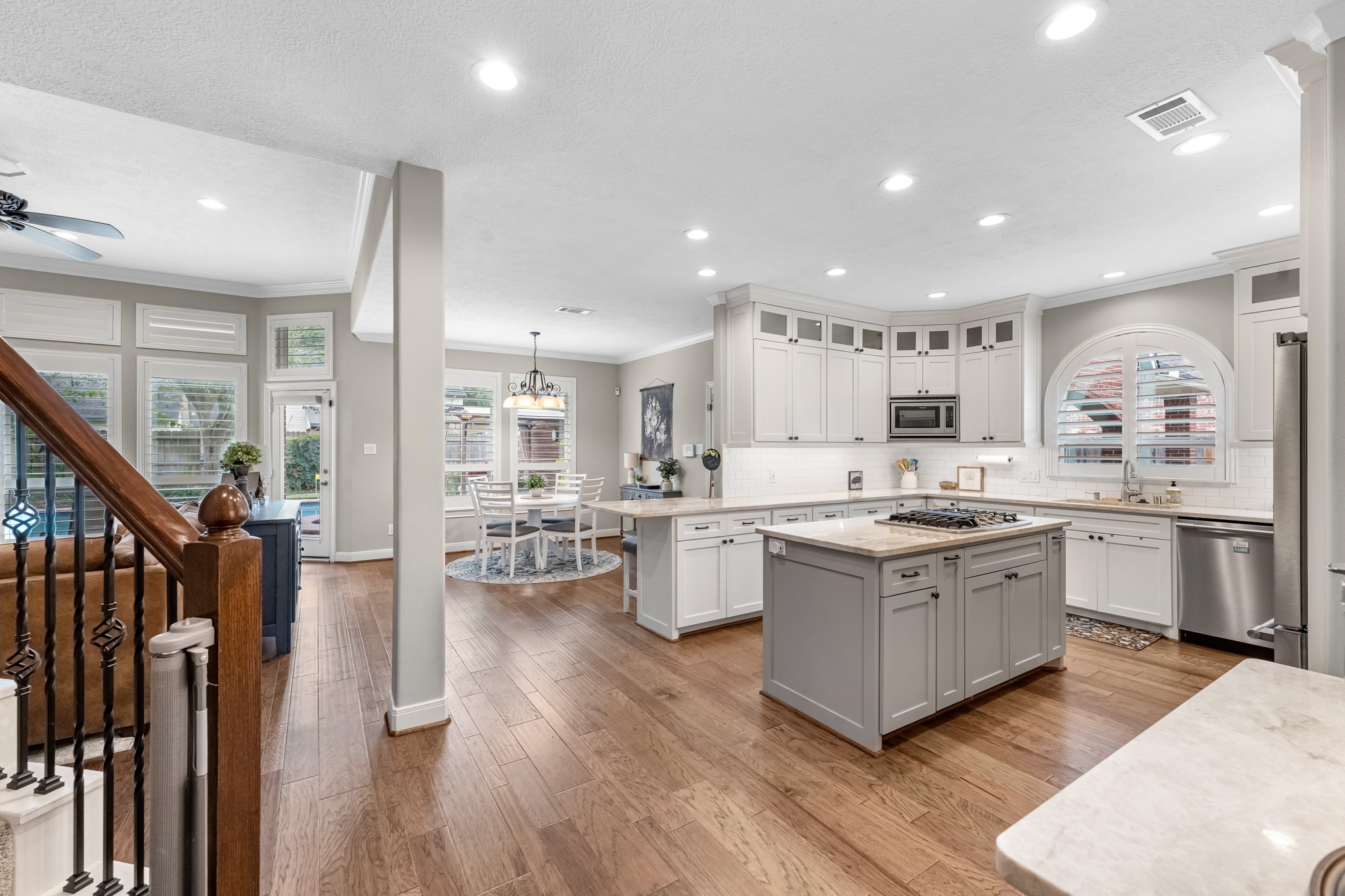 16207 Lafone Drive Spring, TX 77379 - Photo 16 of 49 a large kitchen with stainless steel appliances granite countertop a lot of counter space and wooden floors