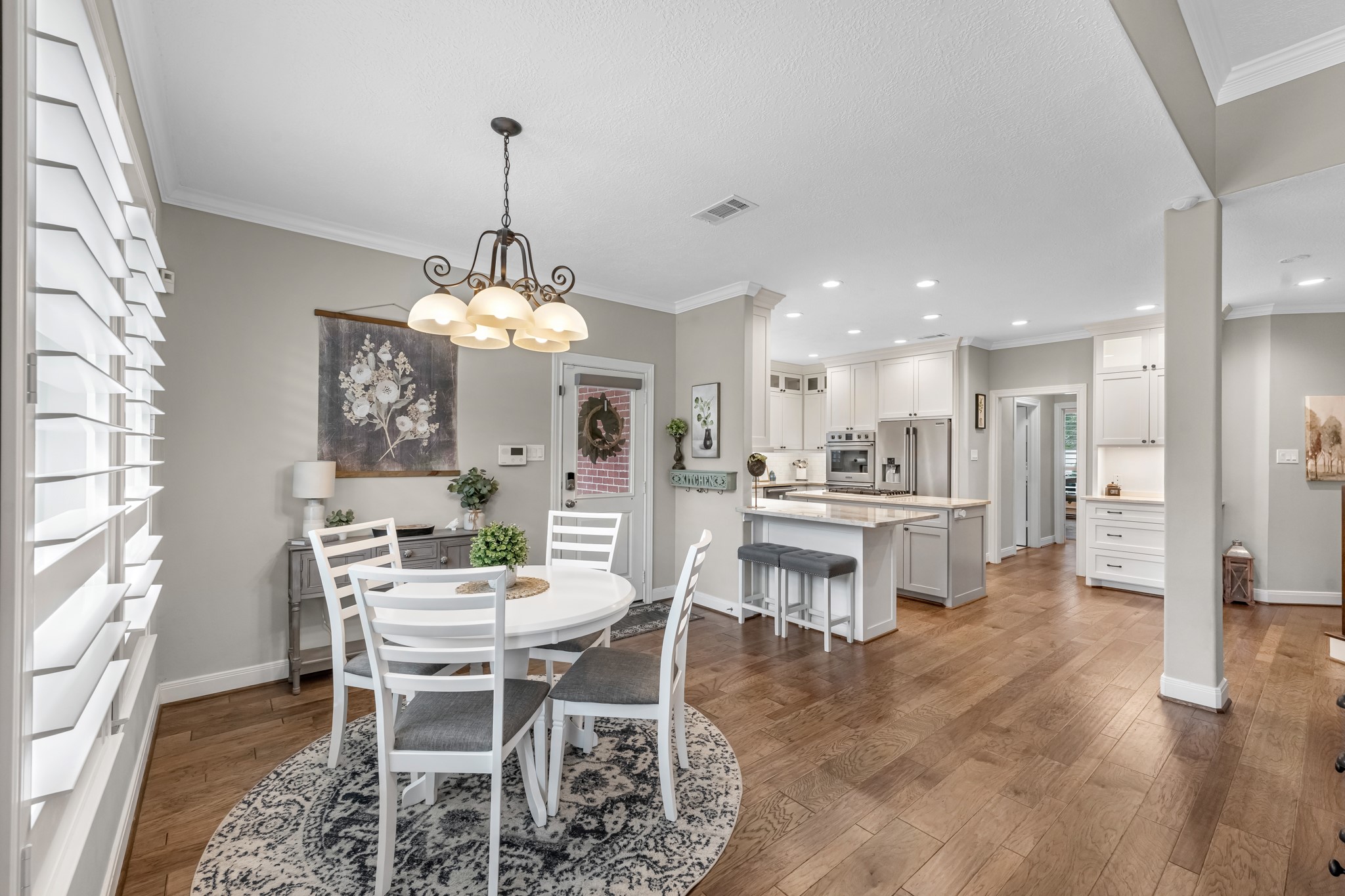 16207 Lafone Drive Spring, TX 77379 - Photo 21 of 49 a view of a dining room with furniture window and wooden floor