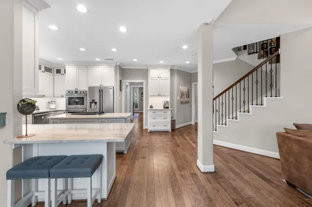 a view of kitchen with furniture and wooden floor