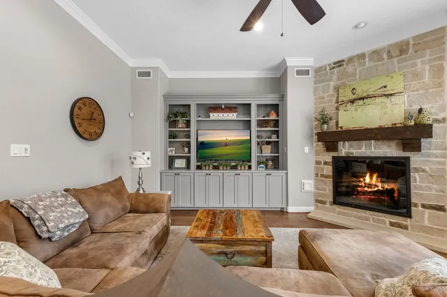 a living room with furniture and a fireplace