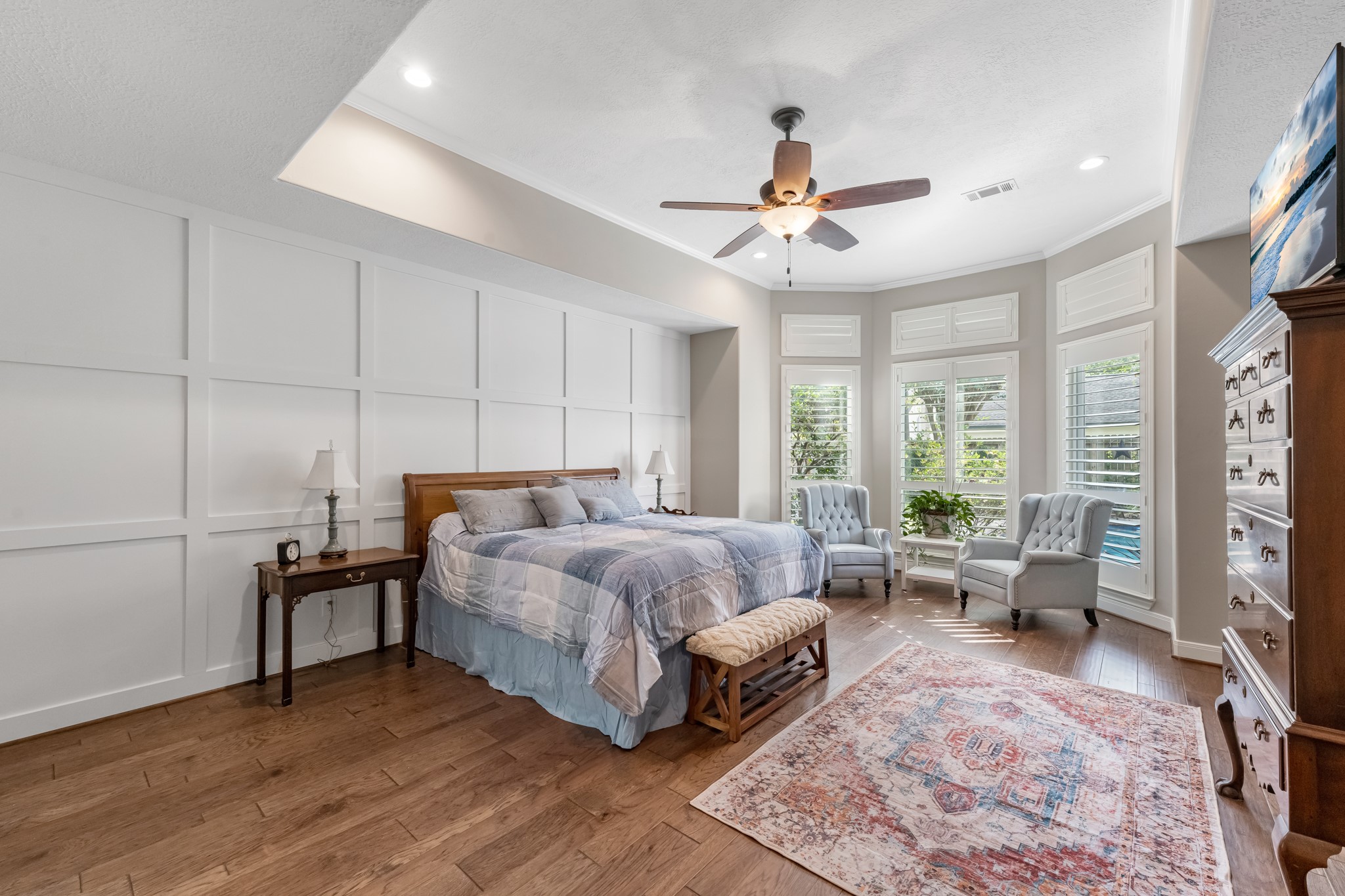 16207 Lafone Drive Spring, TX 77379 - Photo 27 of 49 a spacious bedroom with a bed a couch and large window