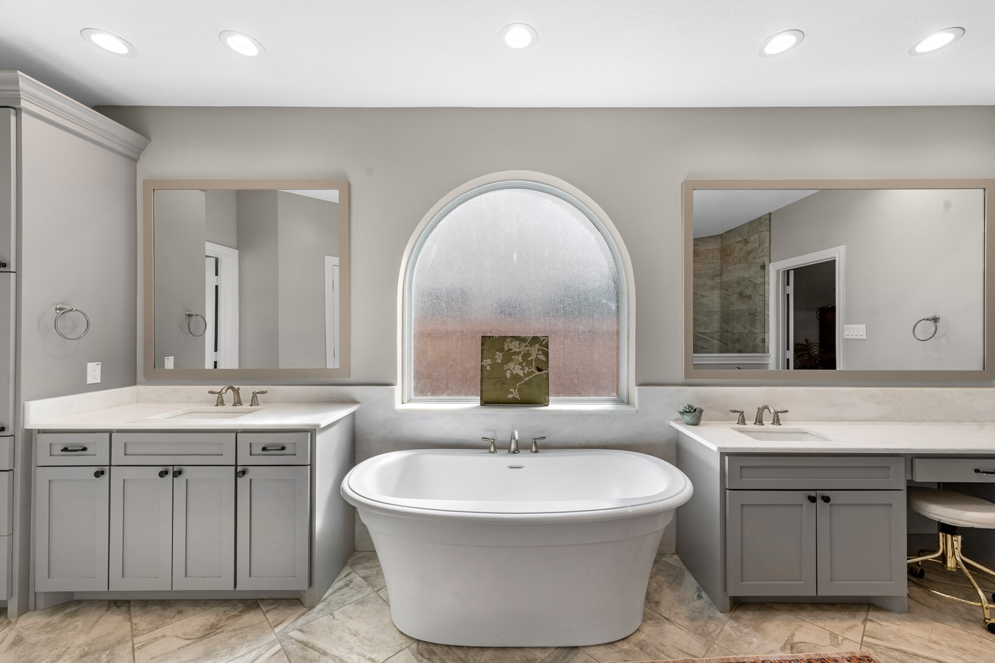 16207 Lafone Drive Spring, TX 77379 - Photo 30 of 49 a spacious bathroom with a double vanity sink double mirror and bathtub