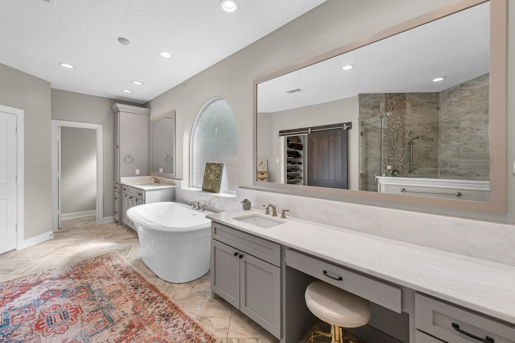 16207 Lafone Drive Spring, TX 77379 - Photo 32 of 49 a spacious bathroom with a double vanity sink mirror and bathtub