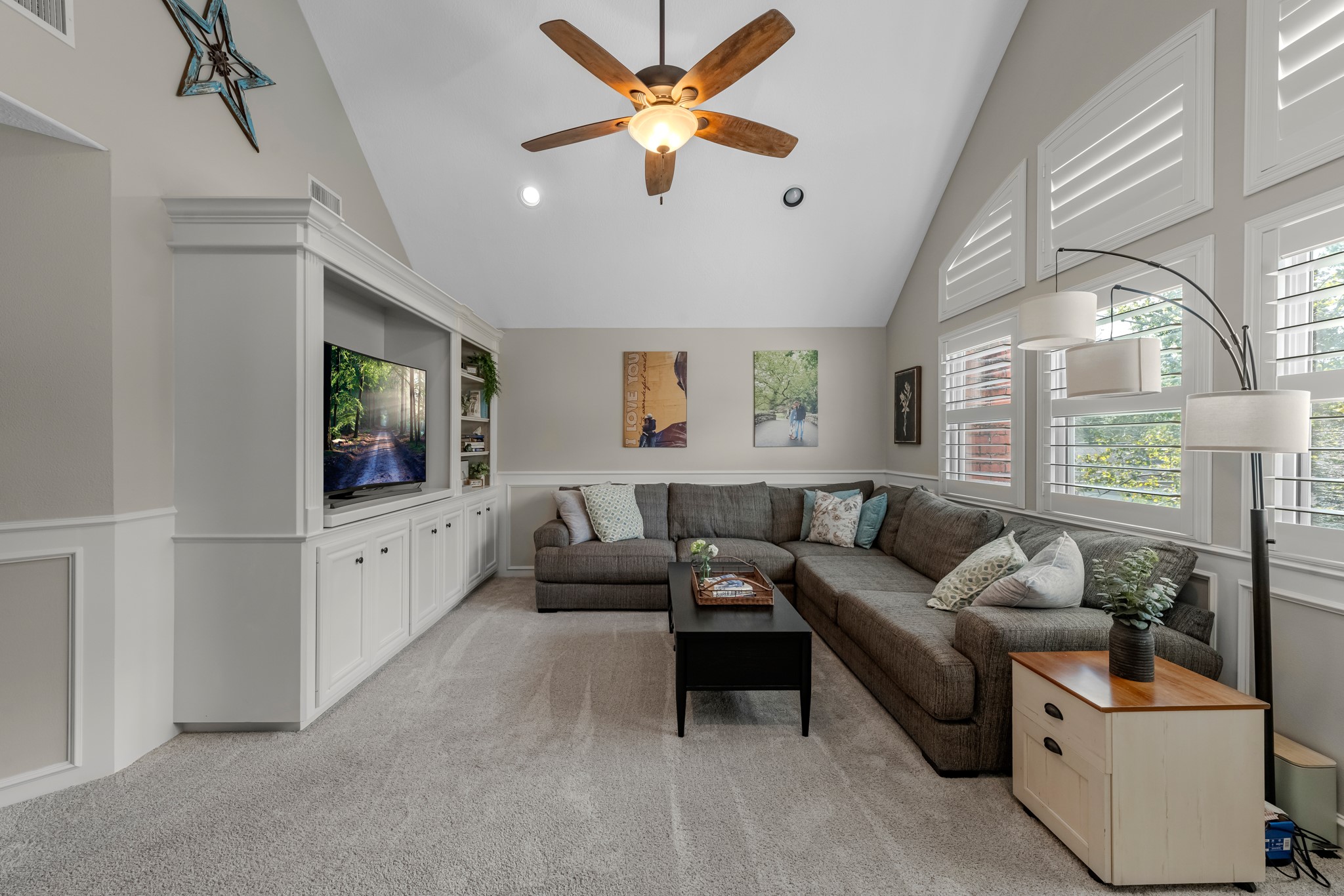 16207 Lafone Drive Spring, TX 77379 - Photo 34 of 49 a living room with furniture and a flat screen tv