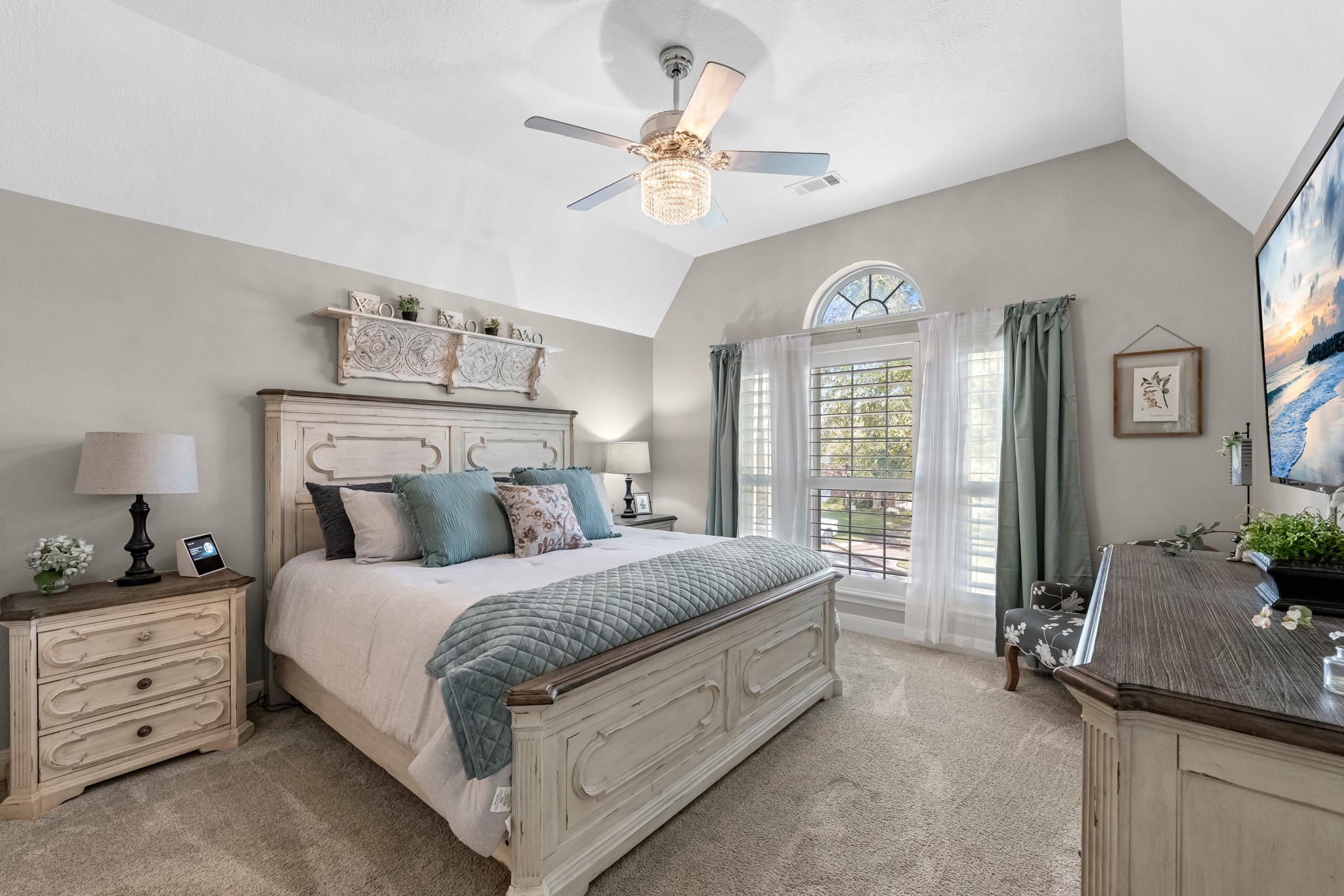 16207 Lafone Drive Spring, TX 77379 - Photo 36 of 49 a bedroom with a bed and a chandelier