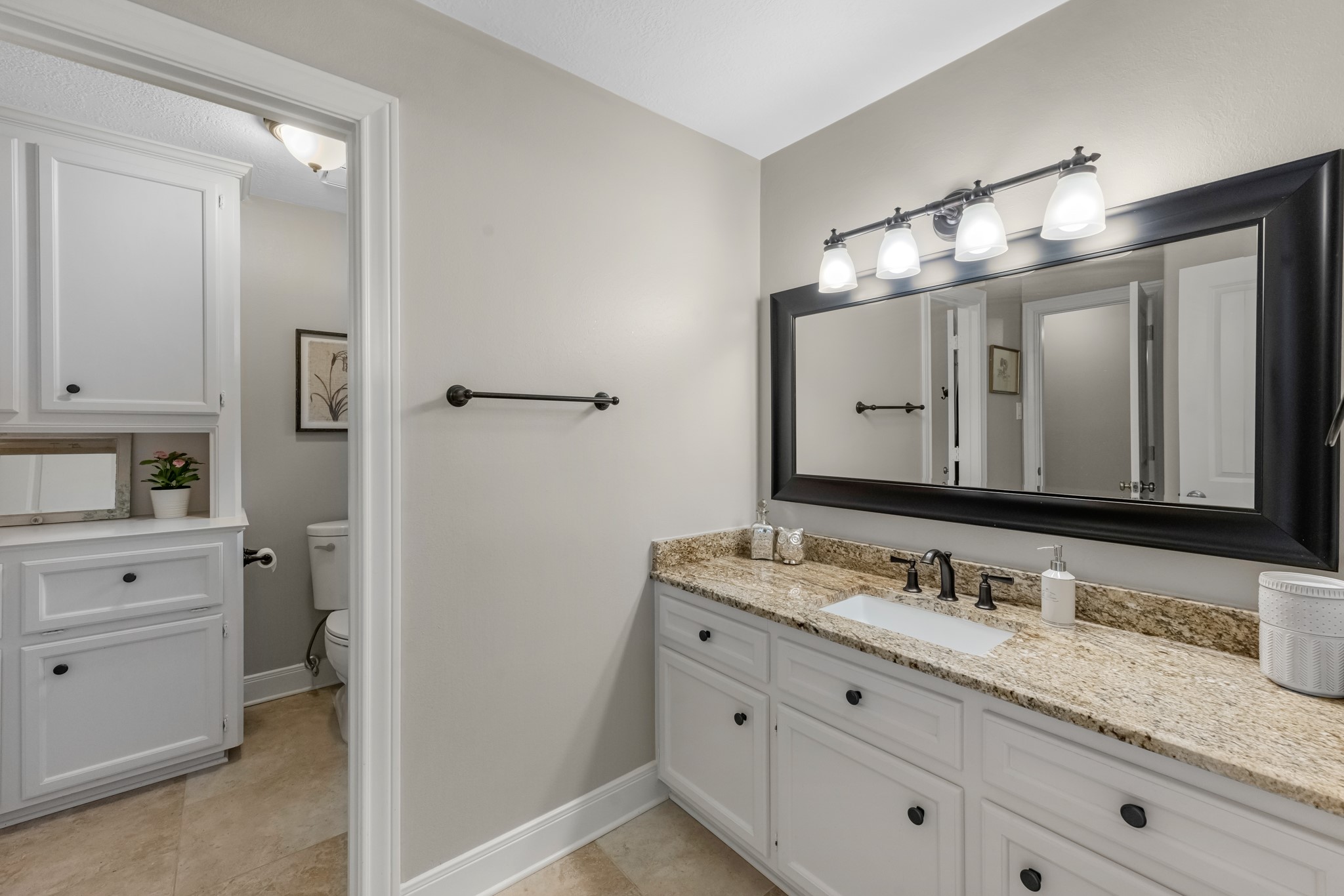 16207 Lafone Drive Spring, TX 77379 - Photo 40 of 49 a bathroom with double vanity sink and a mirror