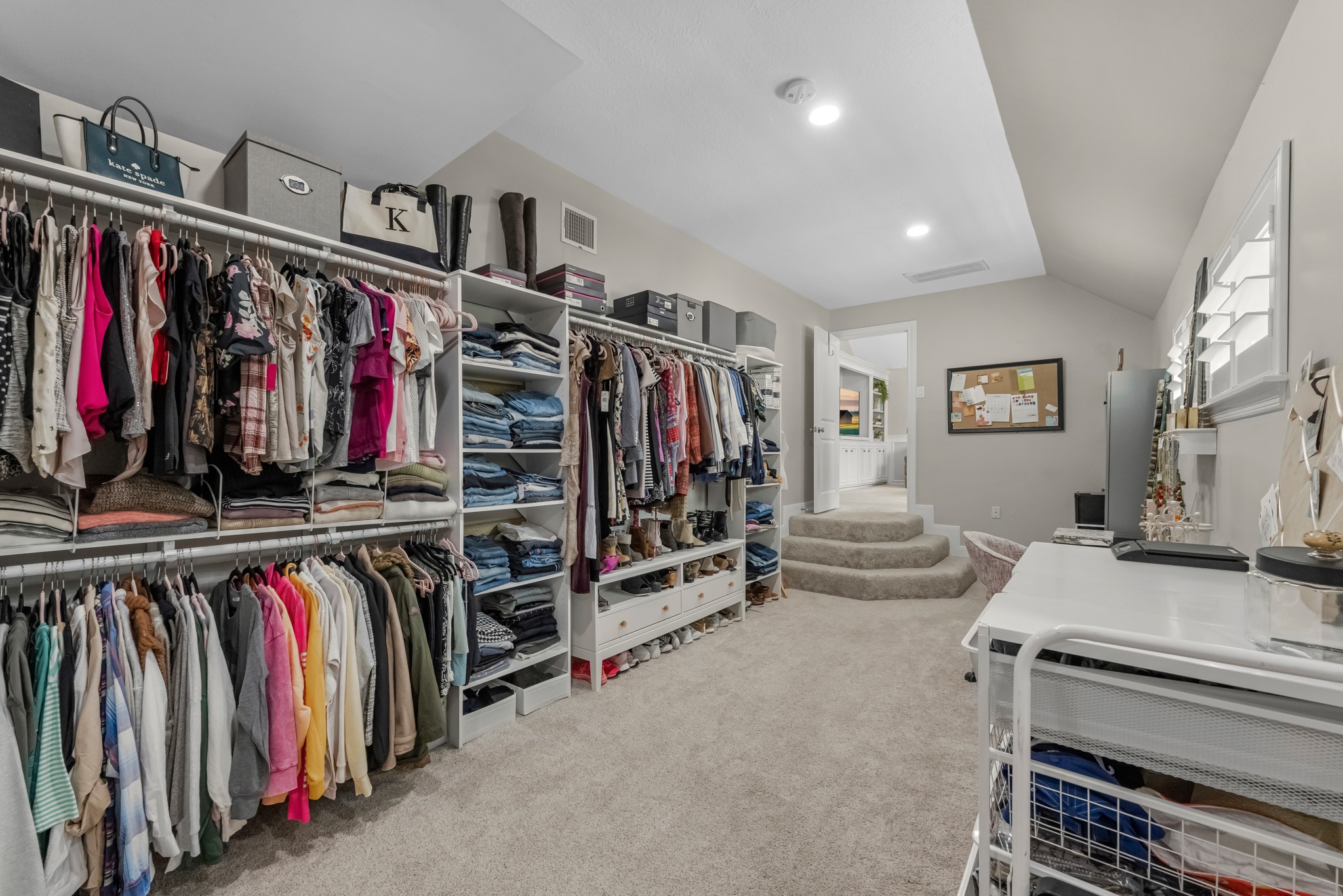 16207 Lafone Drive Spring, TX 77379 - Photo 48 of 49 a view of walk in closet with clothes and shoes