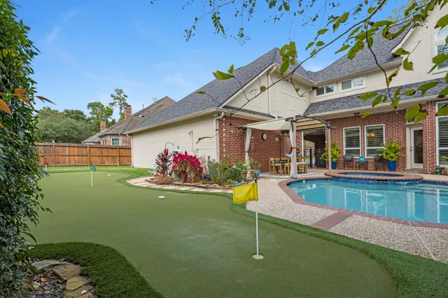 a view of a house with swimming pool