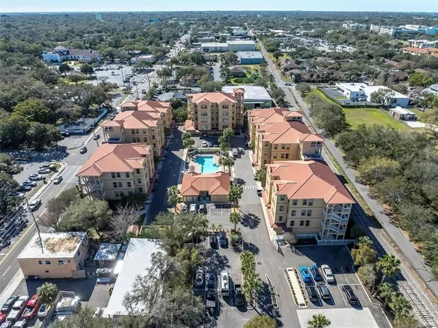 an aerial view of residential houses with outdoor space