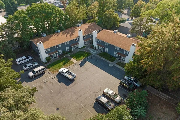 an aerial view of houses with yard