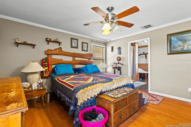 a bathroom with a sink mirror vanity and toilet