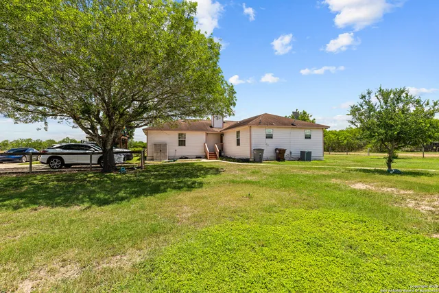 a spacious bedroom with a bed and a walk in closet