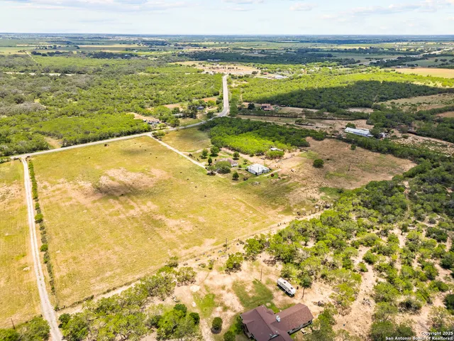 a aerial view of residential houses with outdoor space