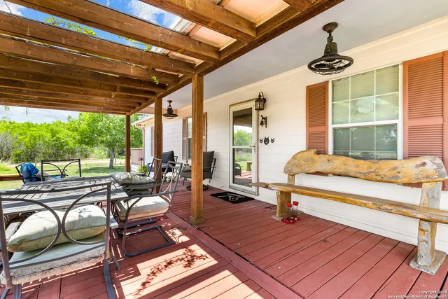 a view of a dining room and livingroom with furniture