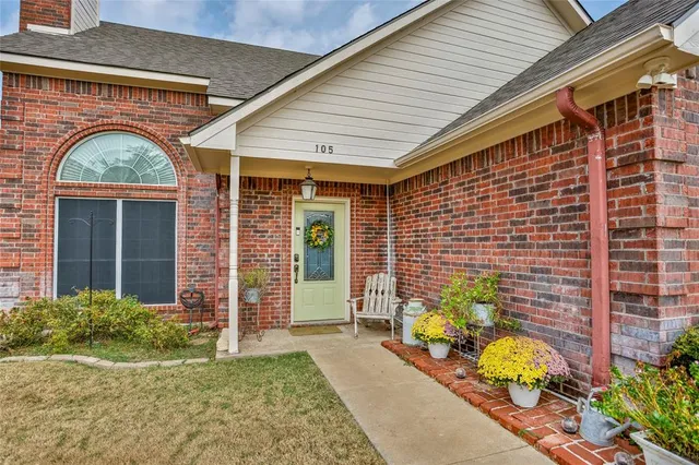a front view of a house with outdoor seating