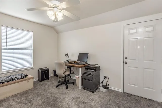 a workspace with furniture and window