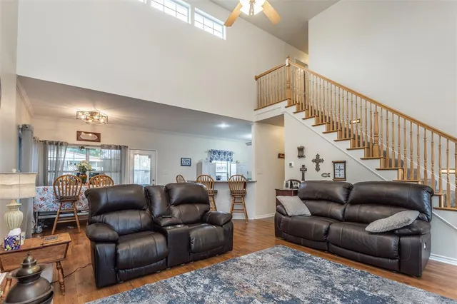 a living room with furniture with wooden floor