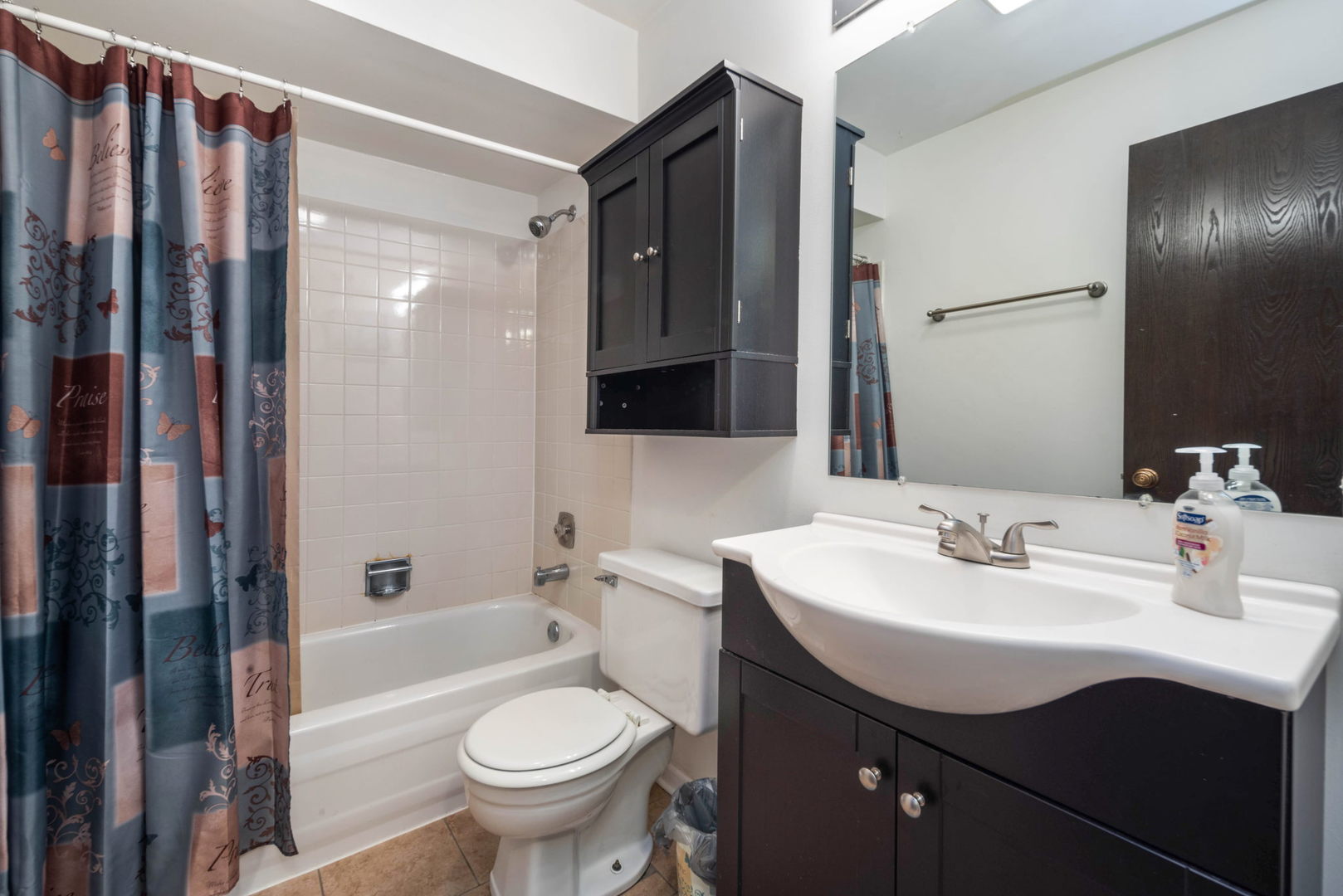 4180 Cove Lane, Unit C Glenview, IL 60025 - Photo 16 of 19 a bathroom with a sink toilet and shower
