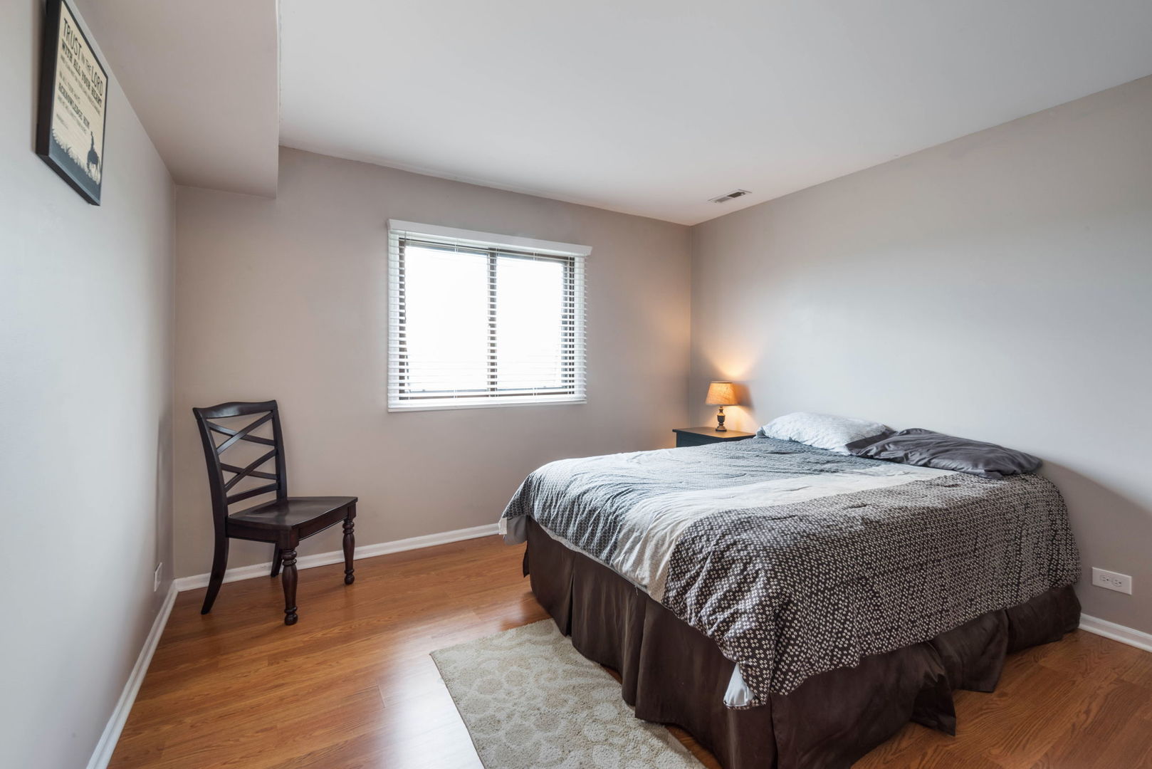 4180 Cove Lane, Unit C Glenview, IL 60025 - Photo 17 of 19 a bedroom with a bed and window