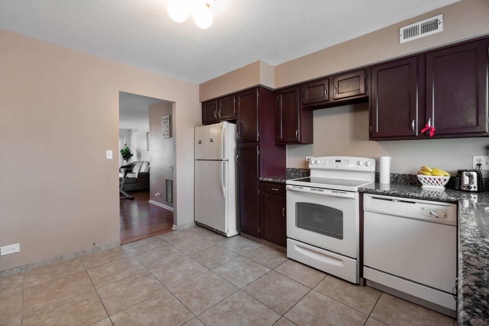 4180 Cove Lane, Unit C Glenview, IL 60025 - Photo 9 of 19 a kitchen with a refrigerator sink and cabinets