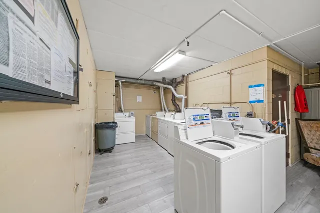 a view of a kitchen with appliances and cabinets