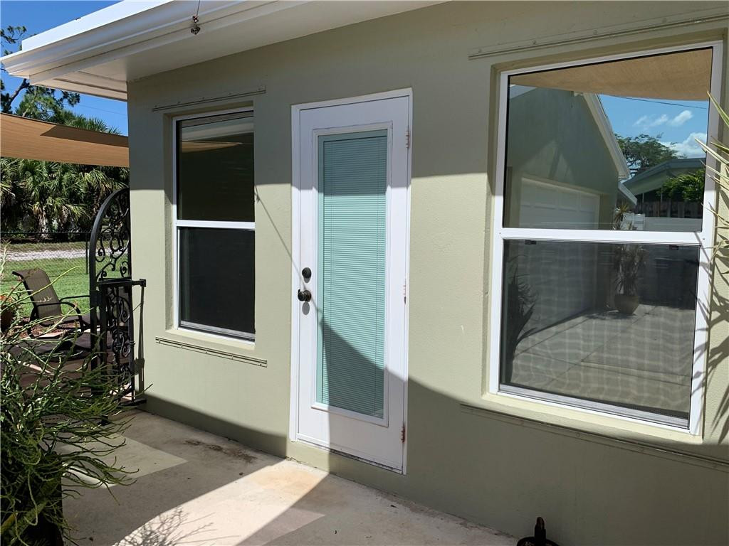 116 West Mango Road Lake Worth, FL 33467 - Photo 55 of 76 entry door to Florida room