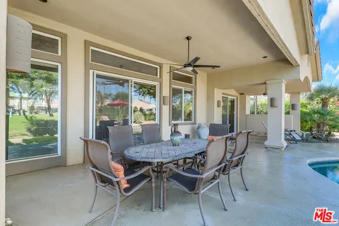 a view of a dining room with furniture window and outside view